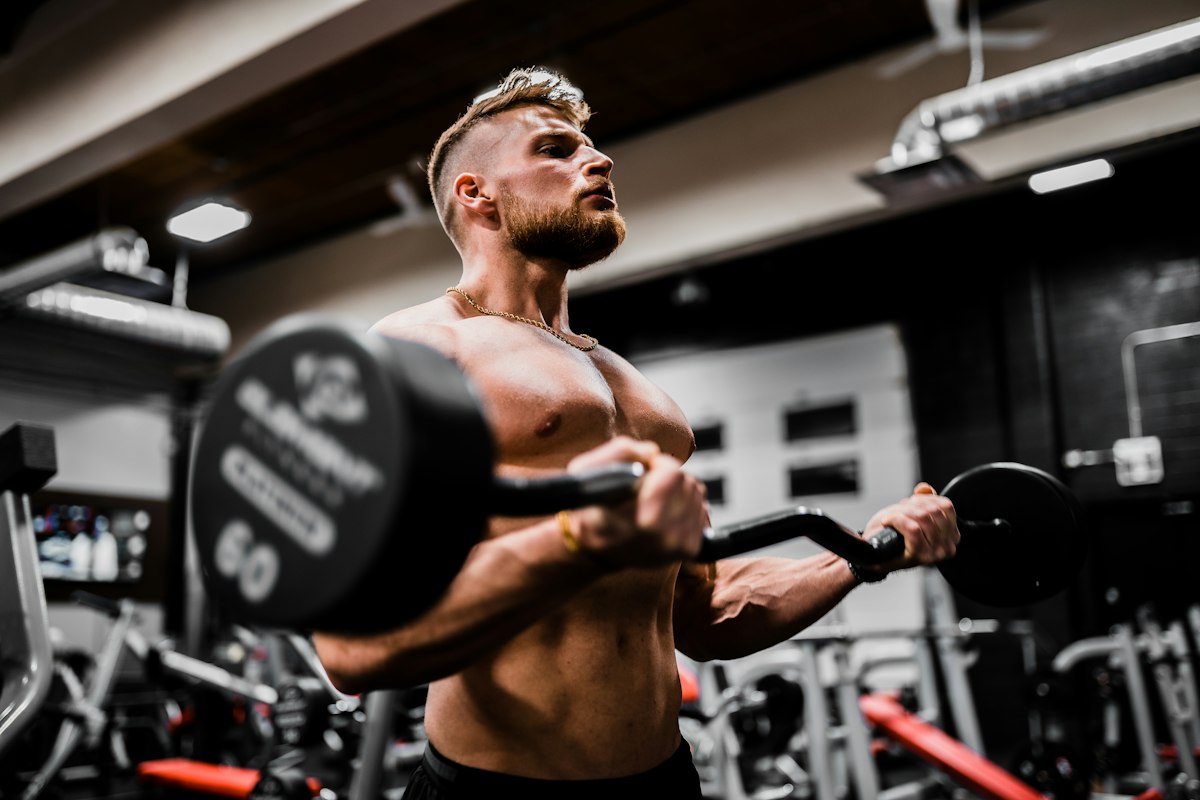 Man curling a loaded barbell